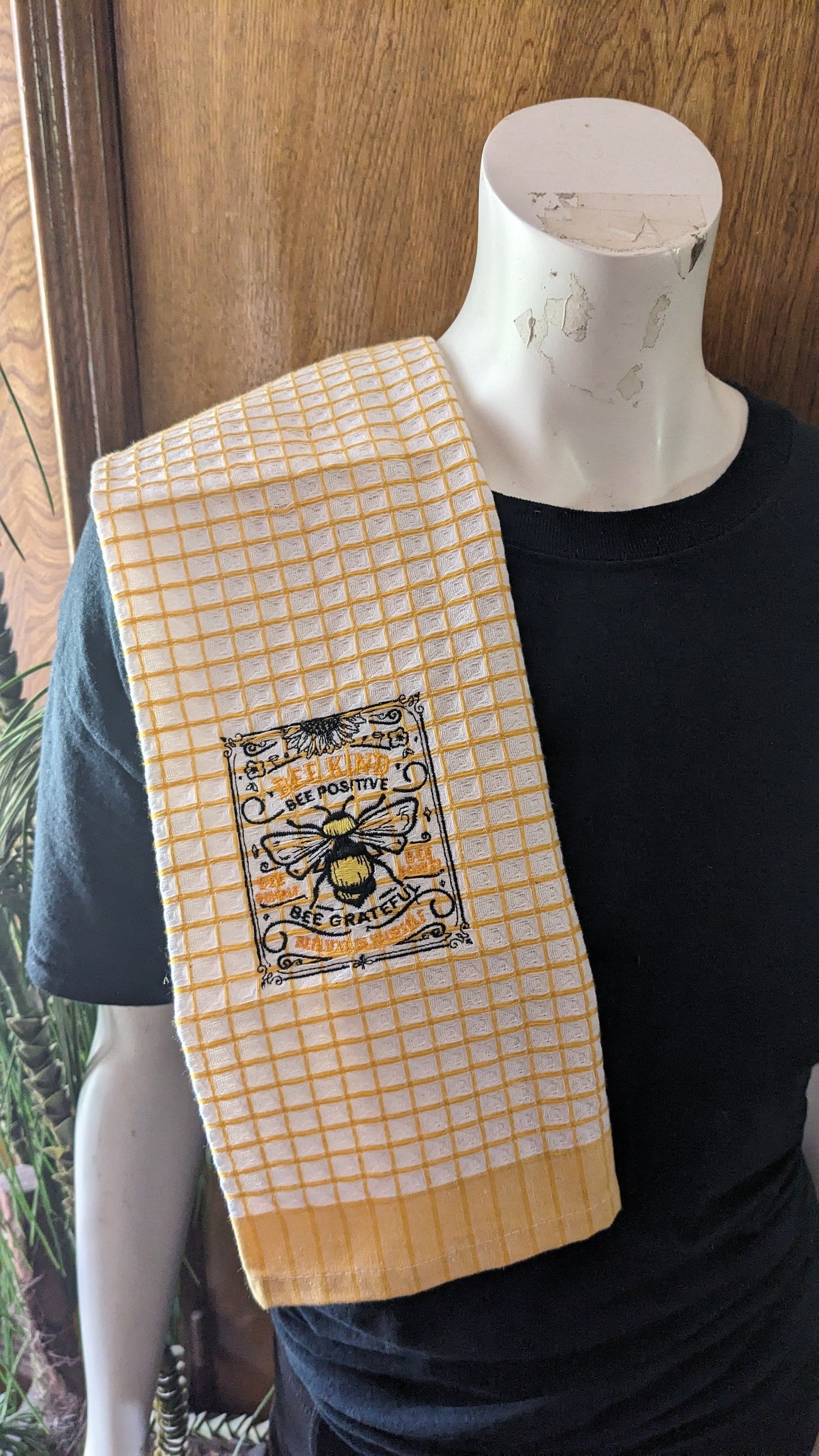 Embroidered bee towel with honeycomb design