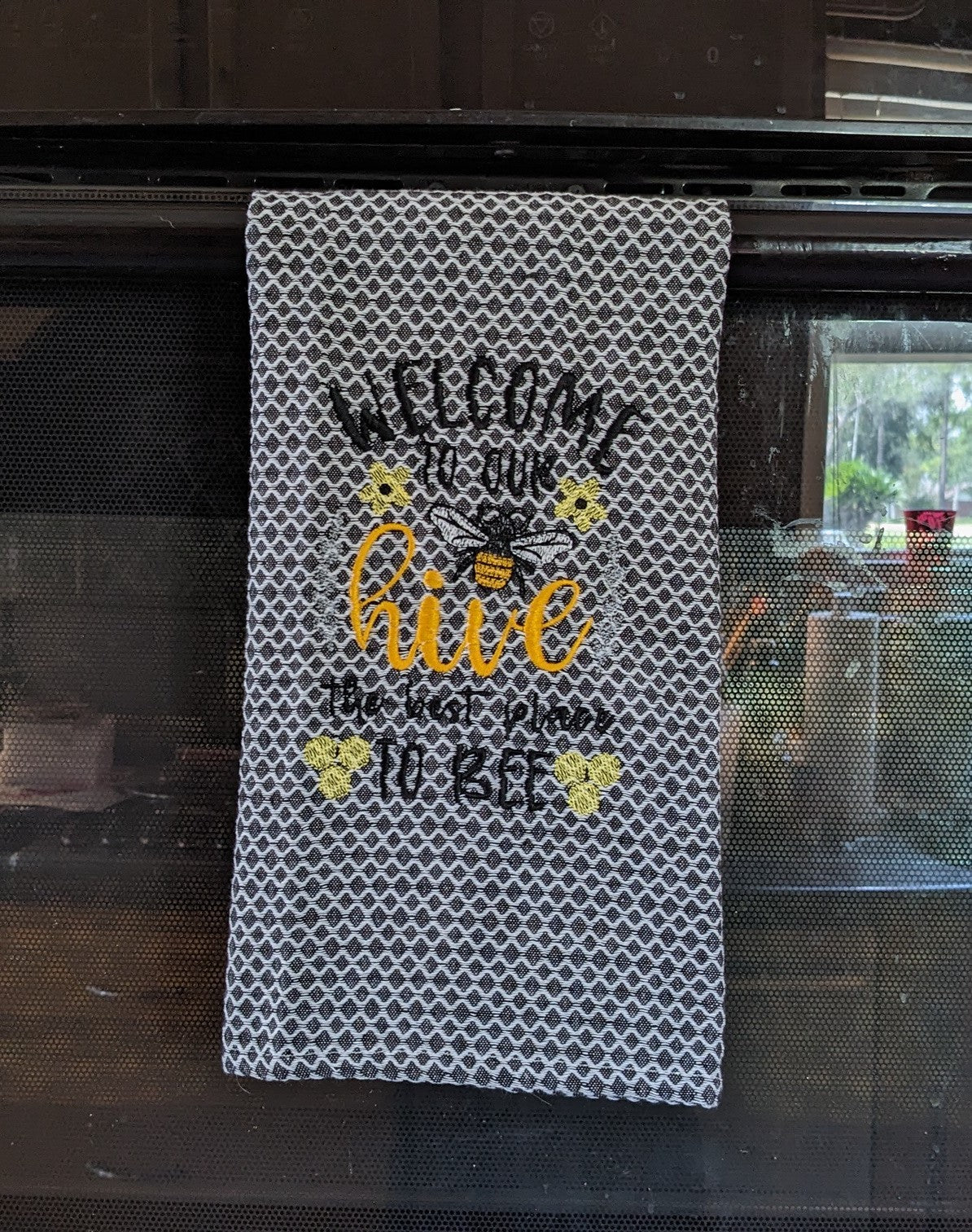 Bee and hive embroidery on white towel